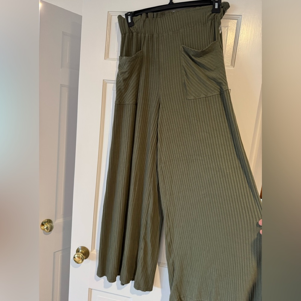 Free People beautifully green flare legged pants.
